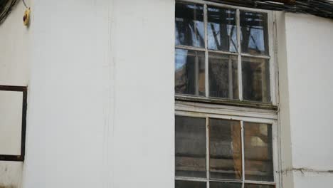 exterior of an old building with wires and windows