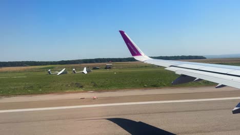 plane window view takeoff suceava airport in romania, fly airplane wing view