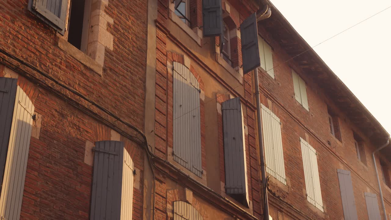 Red Brick Architecture And Window Shutters In Old Town Of Albi At Dusk In France. - wide shot