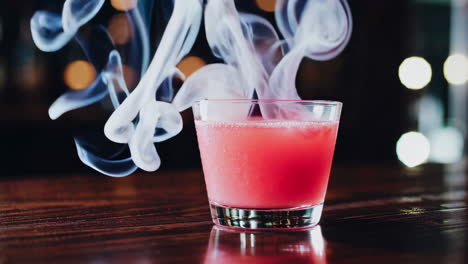 pink cocktail with smoke