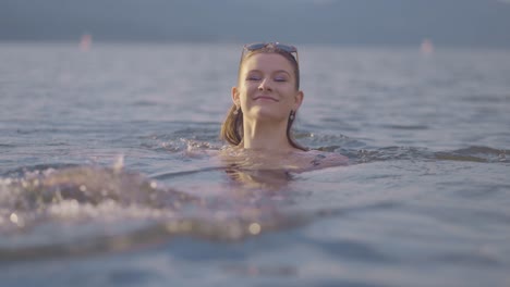 Beautiful-girl-swimming-away-backwards