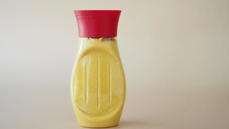 yellow mustard in plastic bottle