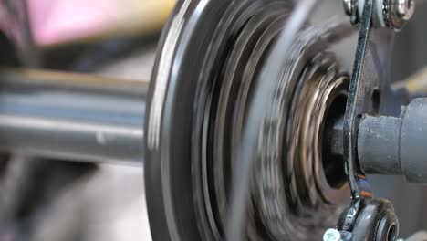 close up shot rear spinning bicycle gear for healthy exercise and sport