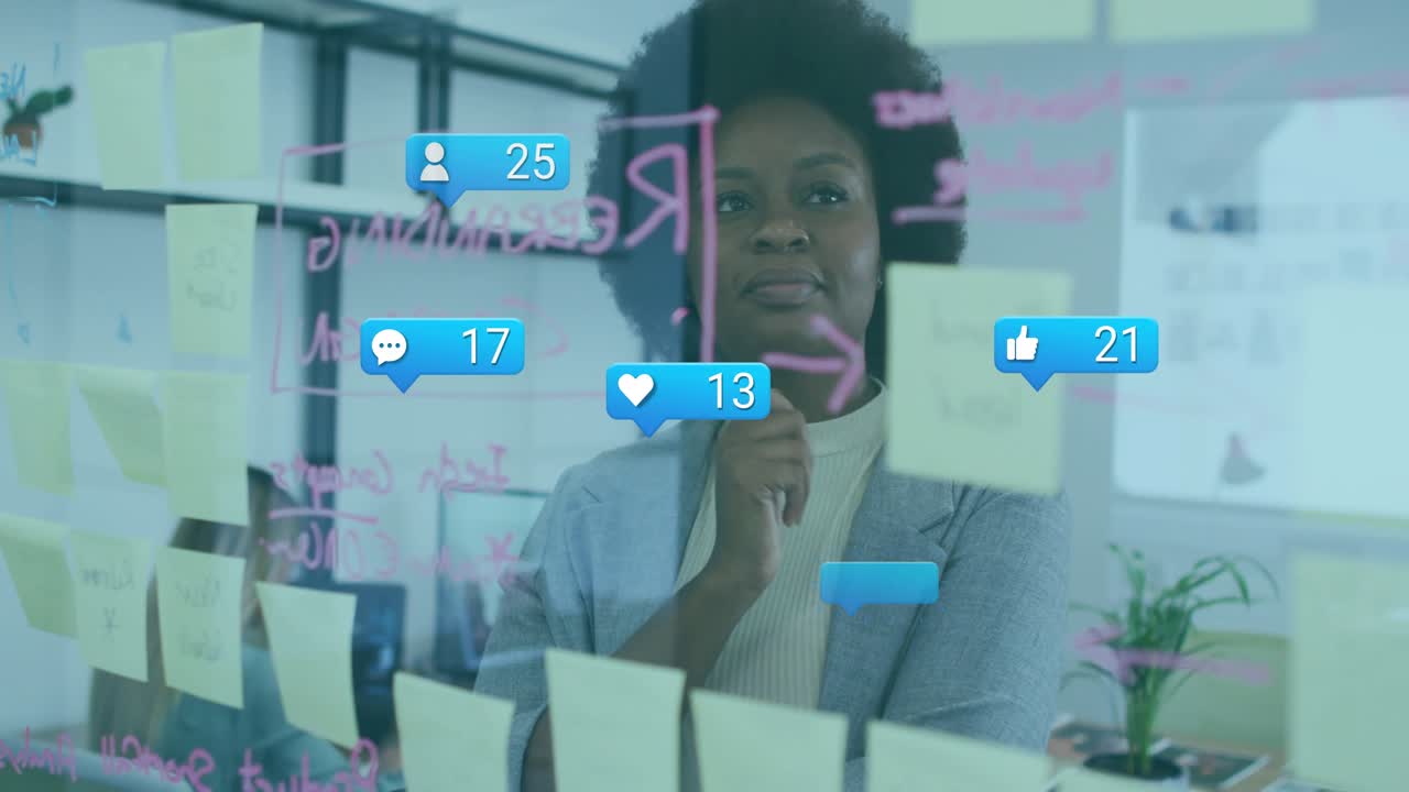 Marketing lead picking marker and planning research tasks on glass wall as feedback bubbles rising