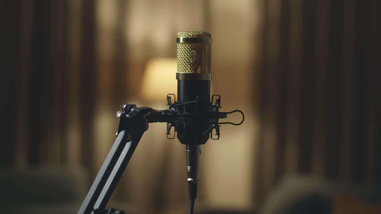 Studio Microphone And Pop Shield On Mic Stand With Yellow Light On Background