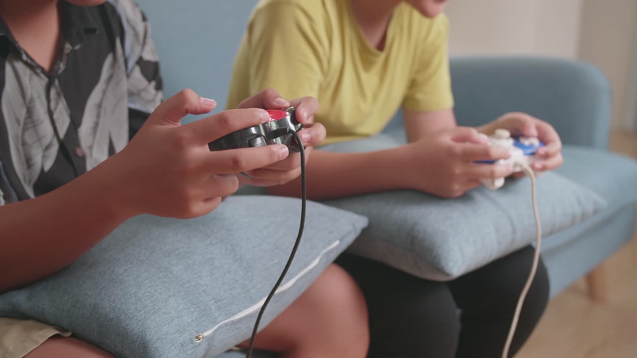 Close Up Children'S Hands Holding Joystick Game Play Video Game At Home