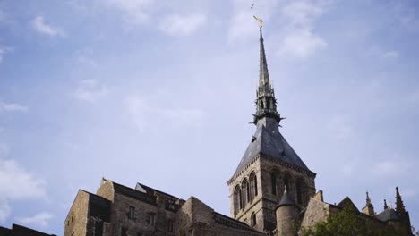 tower of a monastery under a cloudy sky