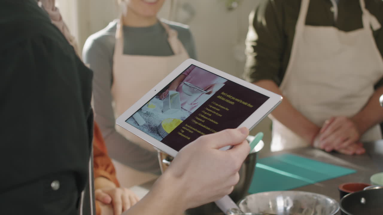 Chef Holding Digital Tablet During Cooking Class