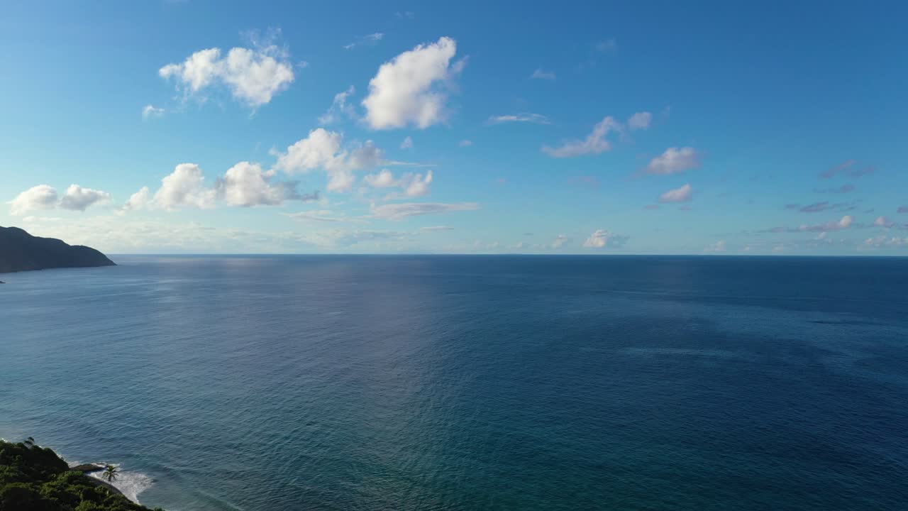 This exclusive Caribbean coastline near St. Croix, USVI, features only a few private villas tucked into the trees above turquoise water and glowing under the heat of the midday sun