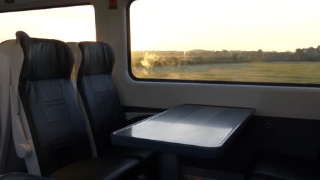 View-Inside-A-Train-With-Vacant-Seats-Traveling-In-The-Morning-To-Dublin,-Ireland