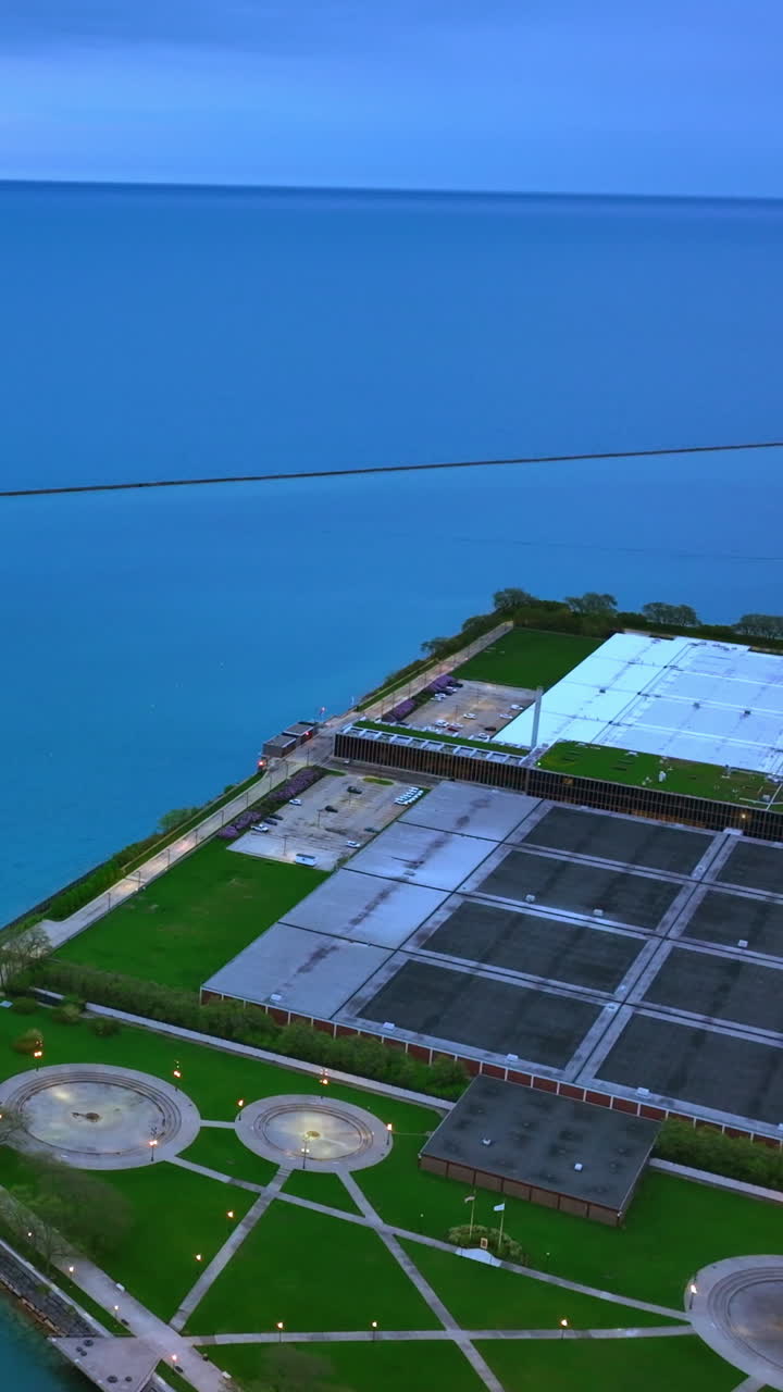 Fantastic scenic view of Lake Michigan from Chicago waterfront. Lonely boat in the blue of water. Vertical video