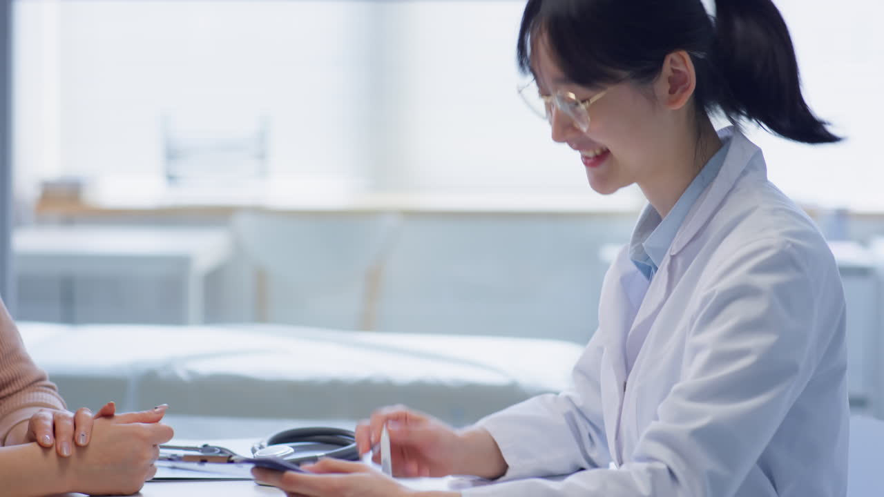 Asian Tween Boy and His Mother Getting Medical Consultation
