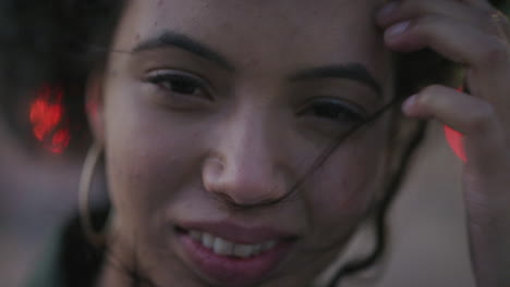 close-up-portrait-beautiful-hispanic-girl-smiling-happy-running-hand-through-hair-enjoying-carefree-lifestyle-looking-happy-calm-slow-motion