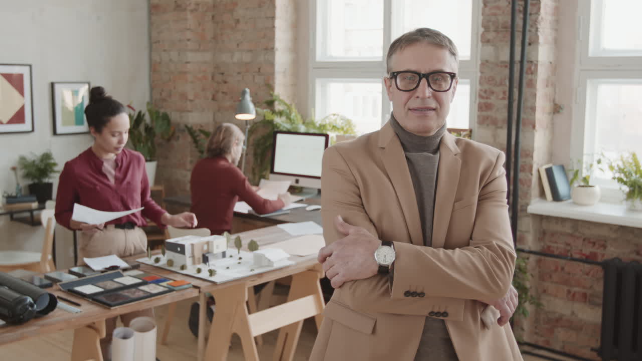 Portrait Of Senior Male Architect At Workplace