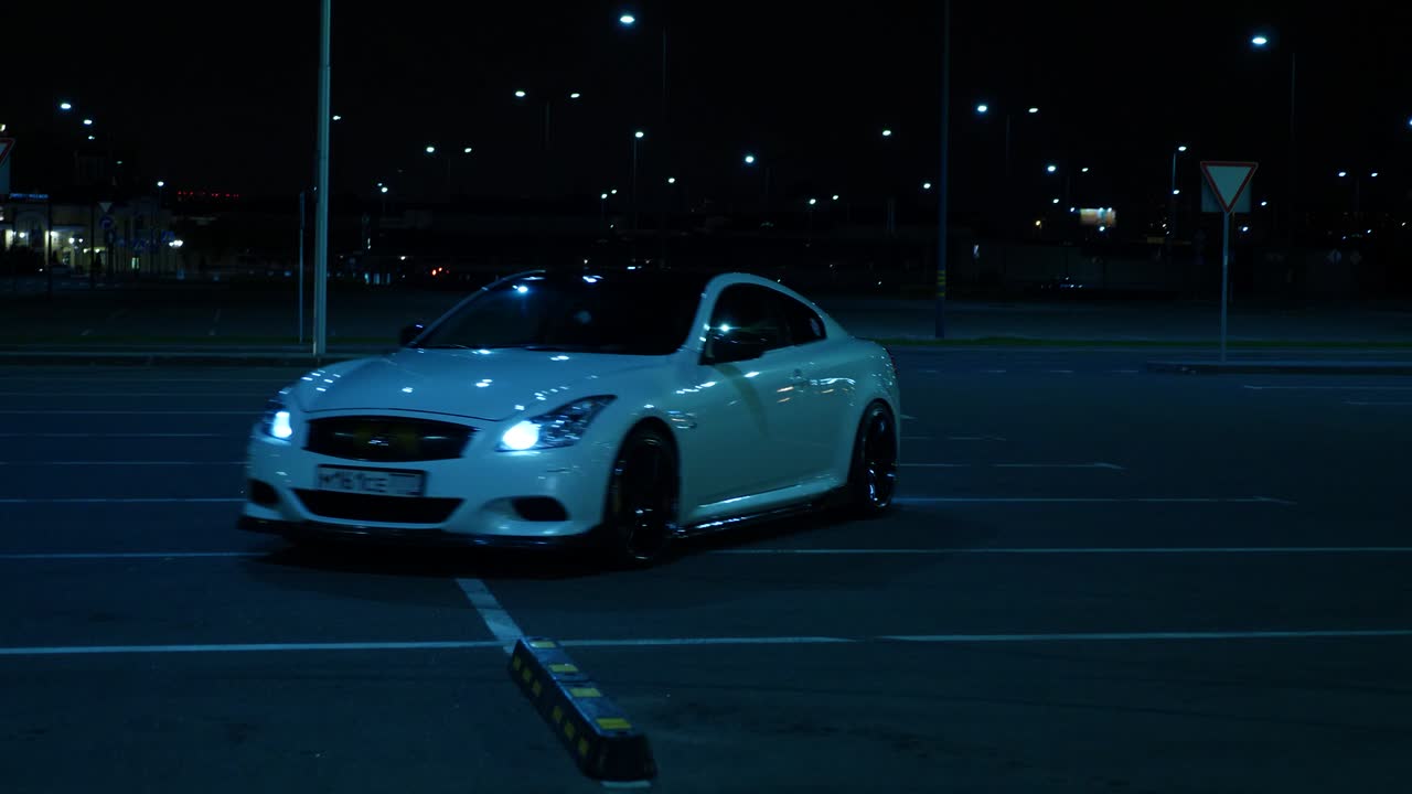 Car in parking lot at night
