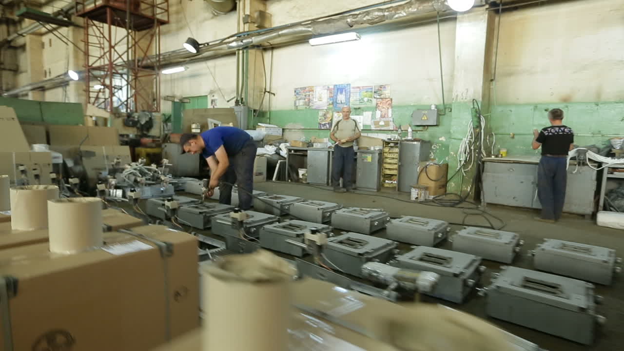 Production Line Inside the Factory. BAR, UKRAINE - AUGUST 2017: People working in production plant