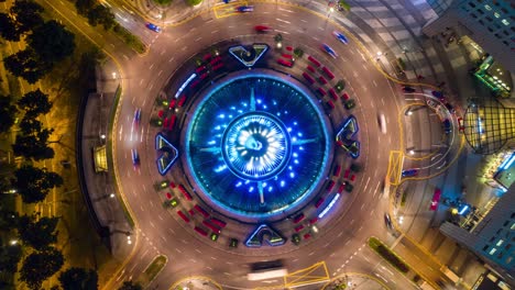 noite iluminada cidade de cingapura círculo de trânsito panorâmica aérea de cima para baixo 4k timelapse