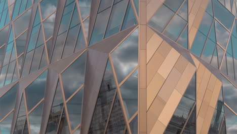 modern building facade with geometric glass and metal panels