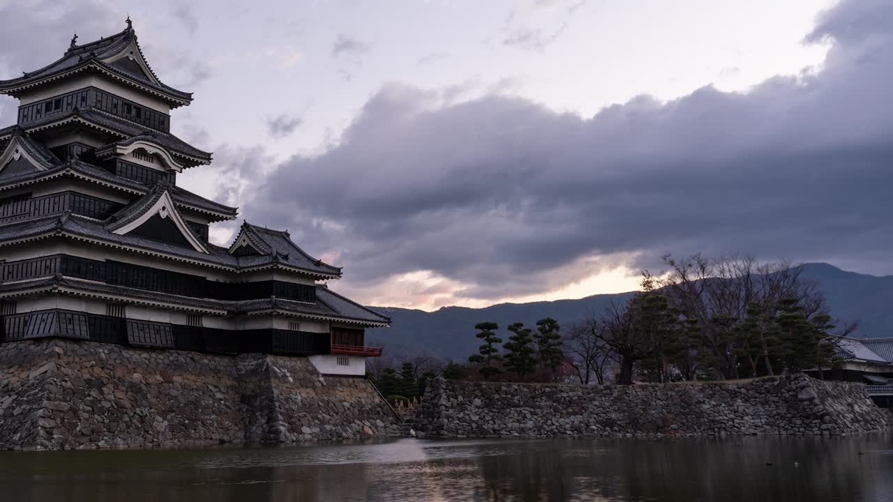 The Premier Historic Castle Of Matsumoto In Japan Under The Gray Clouds On An Early Morning Sunrise - Timelapse