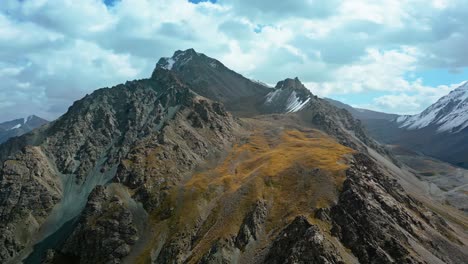 high altitude, remote place, harsh barren craggy rocks, mountain range