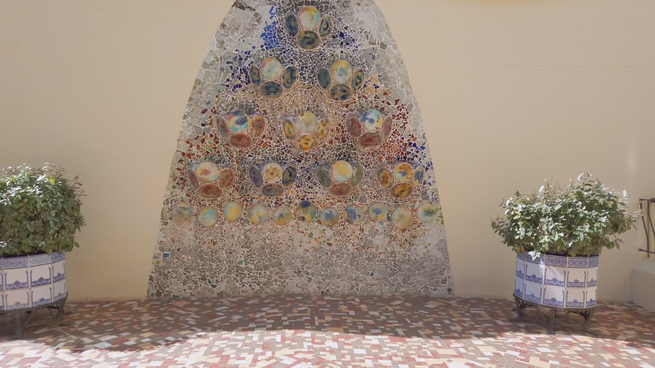 Mosaic on the exterior wall of the rear patio in Casa Batllo, Barcelona 4k 60fps
