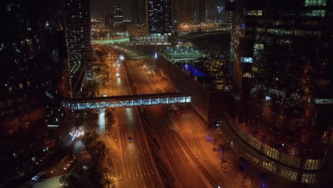 al 'oud street on al reem island in the united arab emirates, uae at nighttime as seen from an office tower or apartment building