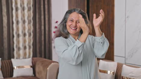 modern indian mother clapping and appreciating