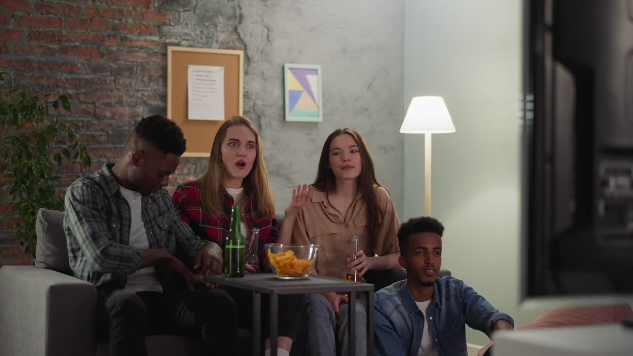 Disappointed woman and boyfriend threatens TV with toy gun