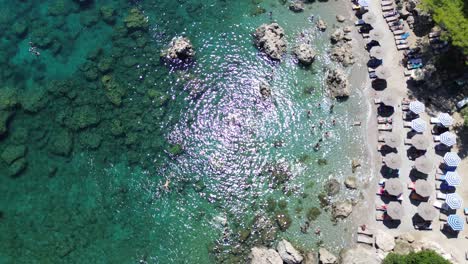 Anthony-Quinn-Bay-in-Faliraki,-Rhodes-in-Greece-during-the-day-with-crystal-clear-water