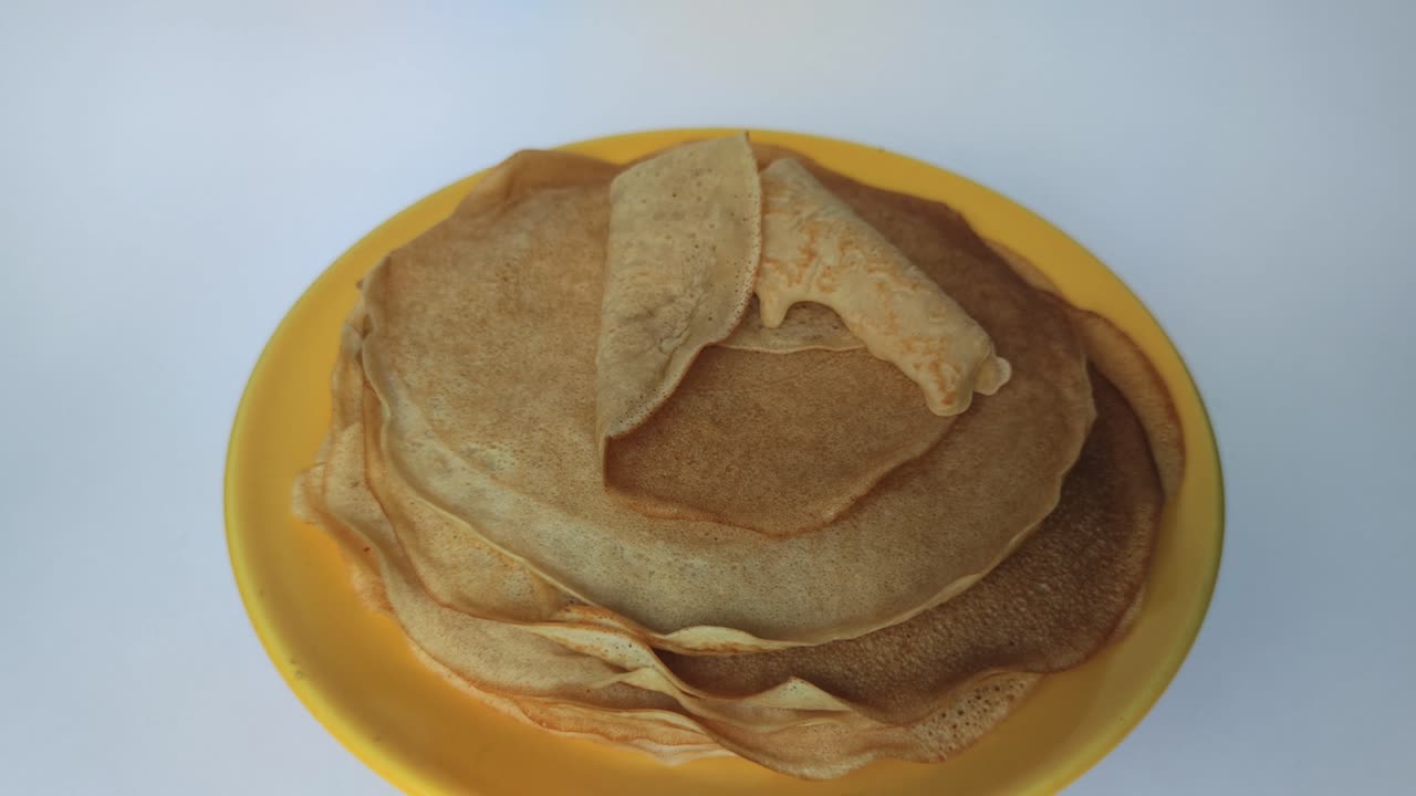 homemade pancakes with wedge syrup. freshly baked pancakes topped with wedge syrup