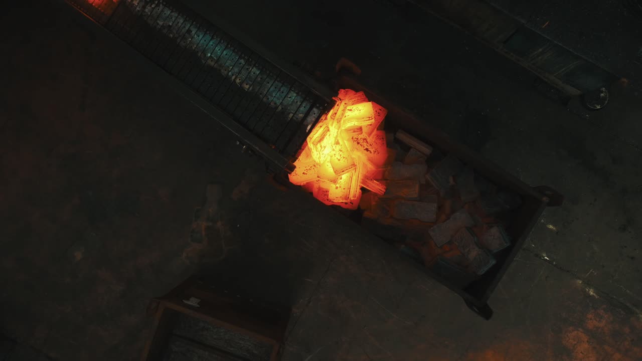 Hot Metal on Conveyor Belt in Factory