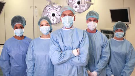 surgical team looking at the camera in operating theater