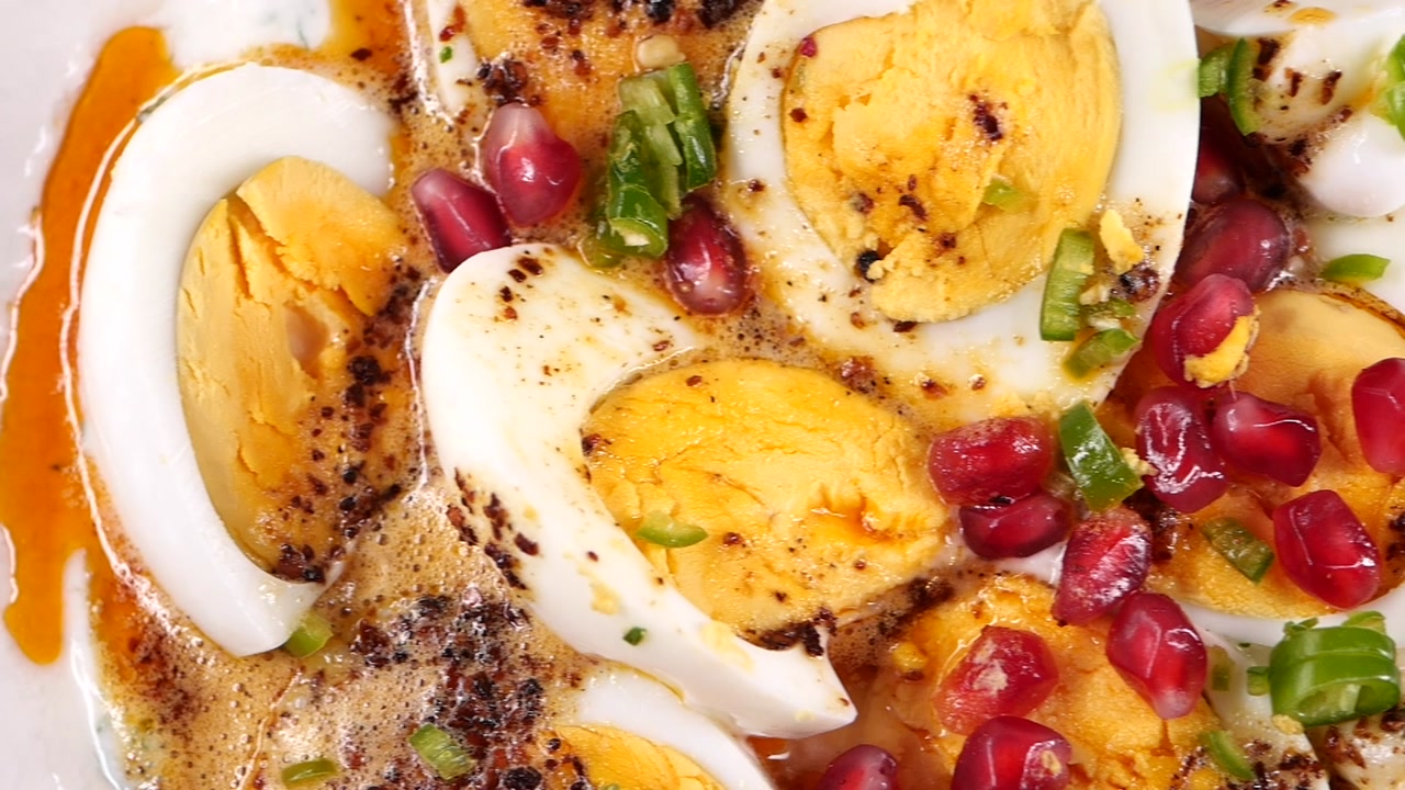 Close-Up of Hard-Boiled Eggs with Yogurt, Pomegranate, and Spiced Oil