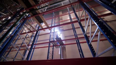 big and modern warehouse under construction, featuring metal shelving and other industrial equipment.