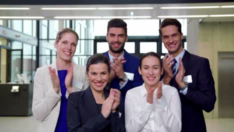 business executives applauding after presentation