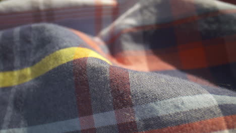 close-up over a plaid patterned cotton shirt