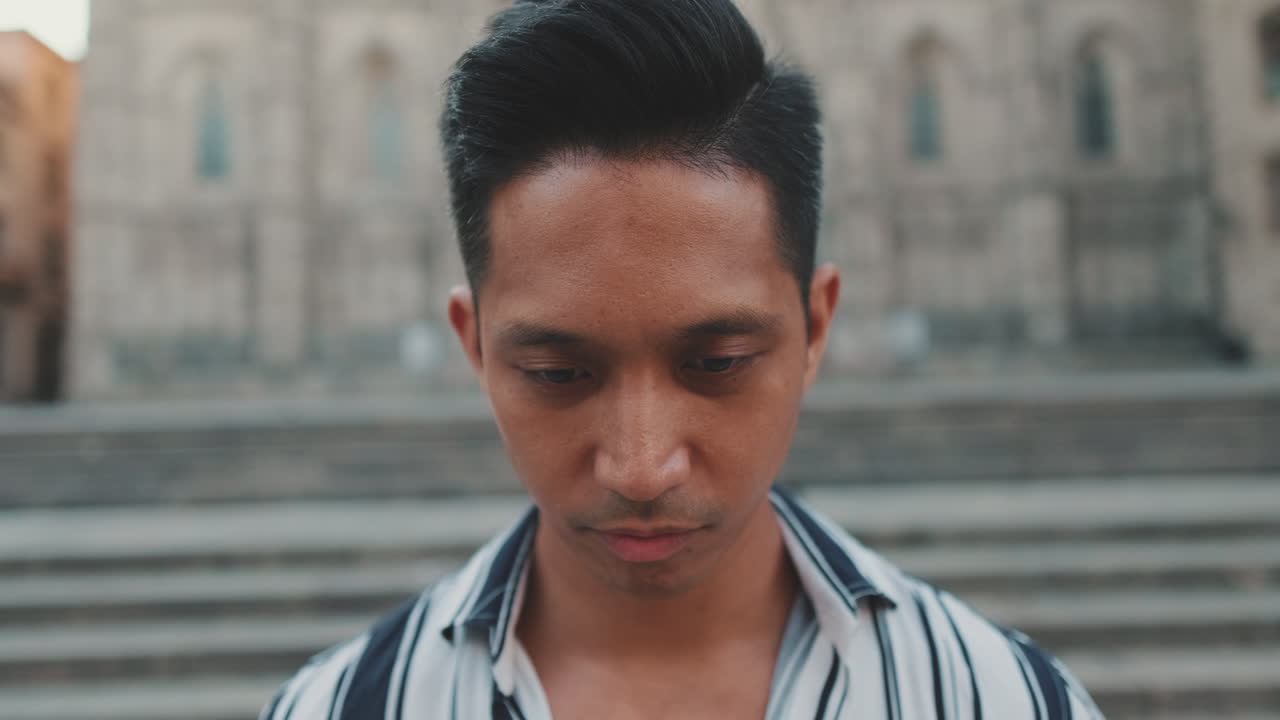 Portrait of a man in front of a building