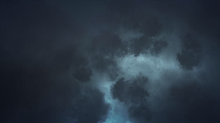 Cloud Lightning - Eerie spectacular and dramatic lightening storm illuminating the inside of dark and sullen clouds with brilliant and intense bolts and flashes of bluey white lightning