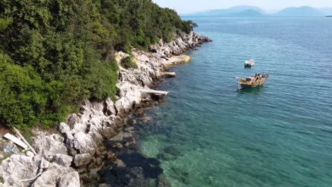 Aerial-Landscape-of-Afteli-Beach-Coastline-with-Calm-Waters-and-Boats,-Lefkada,-Greece