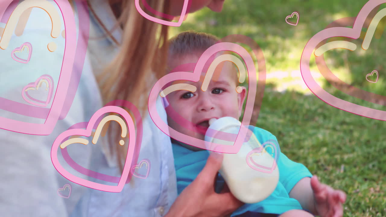 Feeding baby with bottle, woman surrounded by pink heart animation