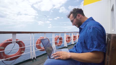 working with laptop on sea voyage in slow motion.