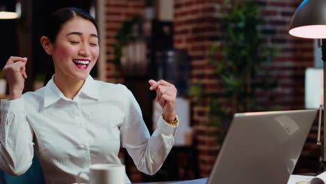 cheerful employee dancing in office, feeling excited after learning of upcoming promotion