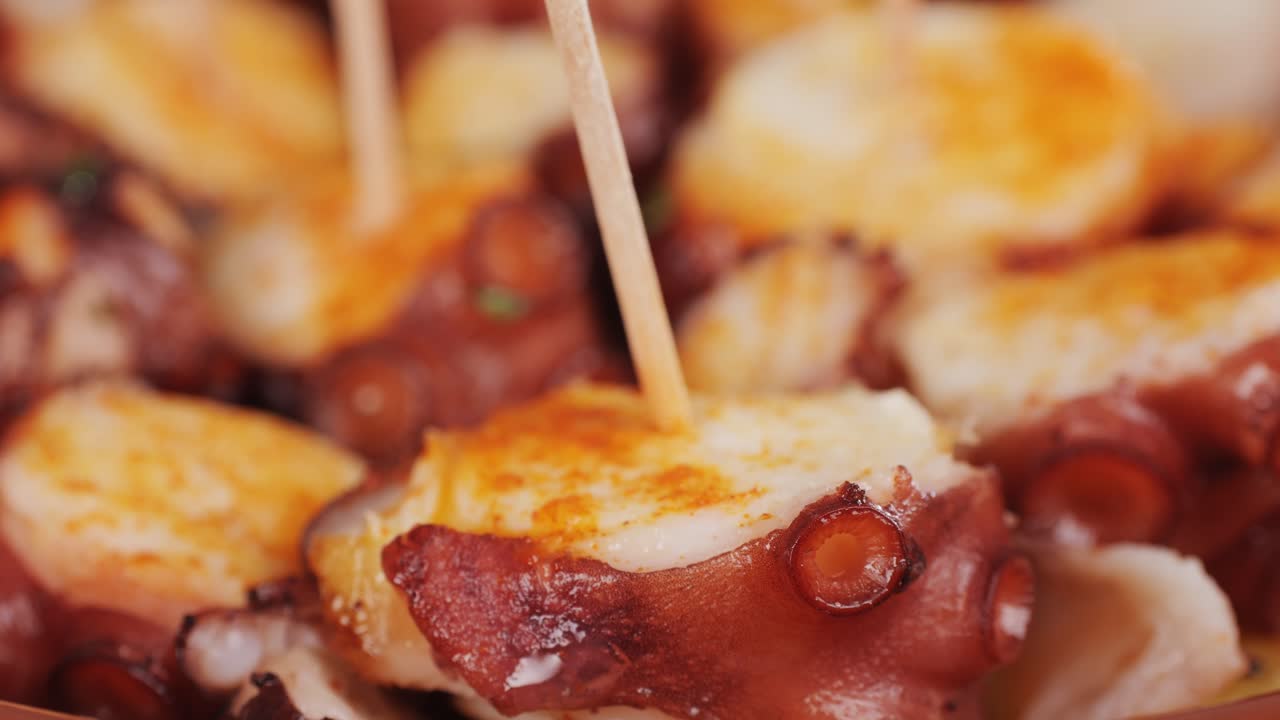 Octopus cooking, chef grill fresh octopus galician style on restaurant kitchen, healthy food, seafood cafe in spain, traditional asian japanese spanish and mediterranean dish.