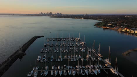 drone footage flying over boats docked in brighton beach in melbourne, australia