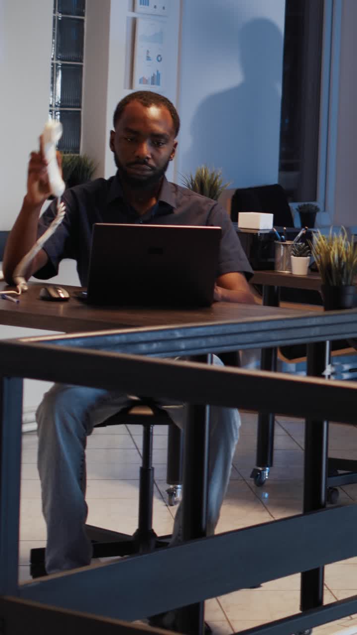 Vertical video: Corporate employee answering landline phone call