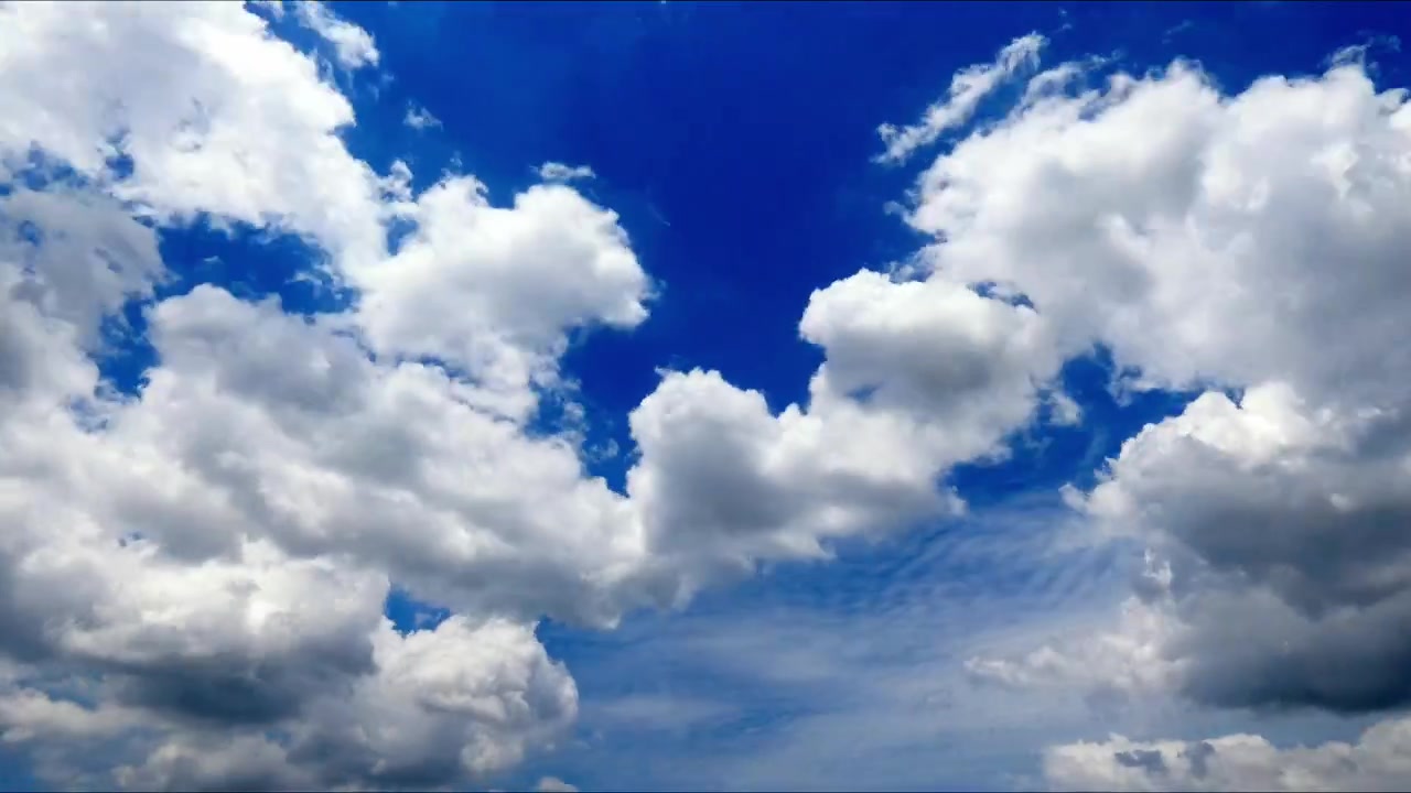 Timelapse of dramatic cloud formations moving across an open sky, creating dynamic natural patterns and changing atmospheric conditions.