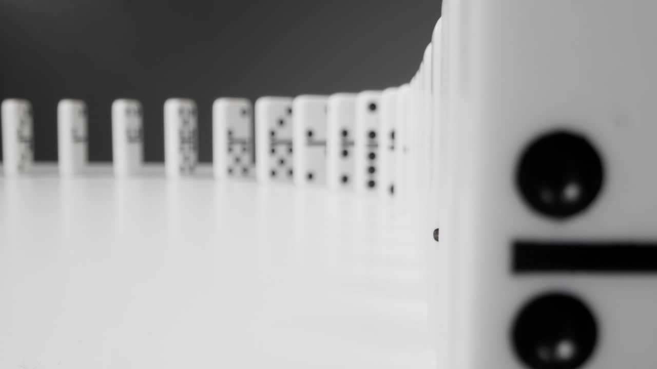 Tracking Shot Of Dominoes Falling