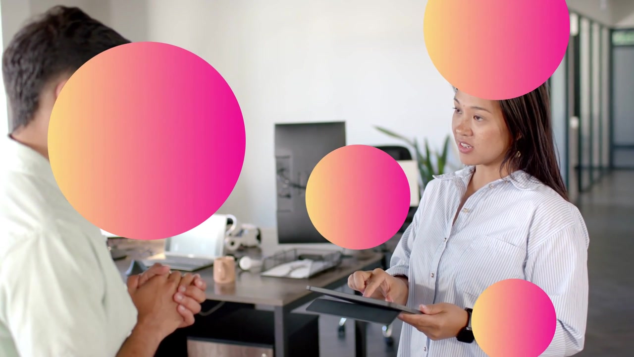Woman tapping tablet, presenting business chart while man listening, pink circular overlays moving