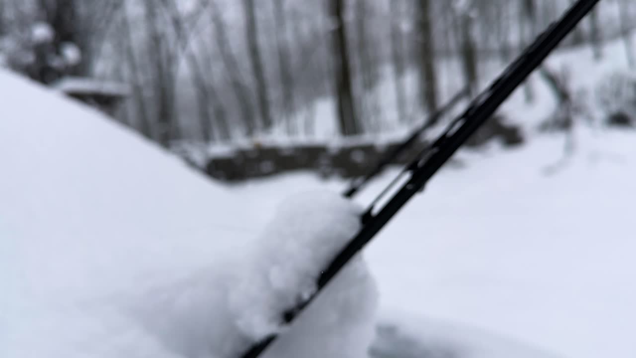 Car covered in heavy snow wiper storm view in forest mountain vehicle countryside village transportation Iran winter nature Hyrcanian scenic travel frozen cabin ice highlands frost backyard Gilan