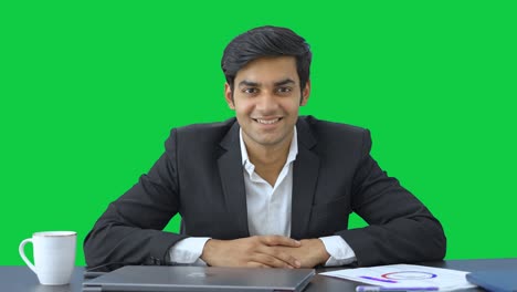 Happy-young-Indian-businessman-smiling-Green-screen